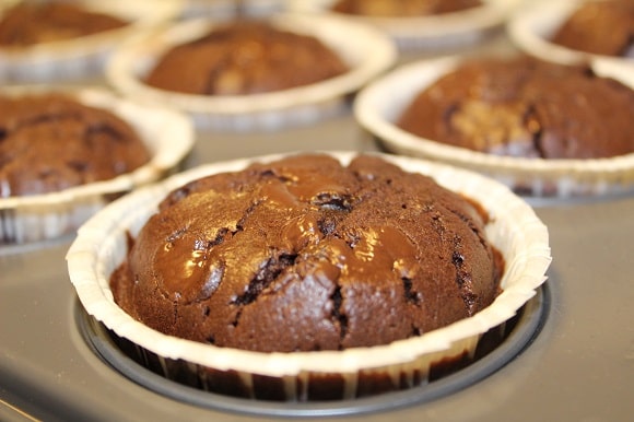 an image of baked chocolate muffins in a muffin pan