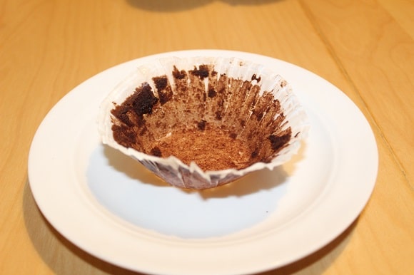 an image of an empy muffin wrapper on a small plate
