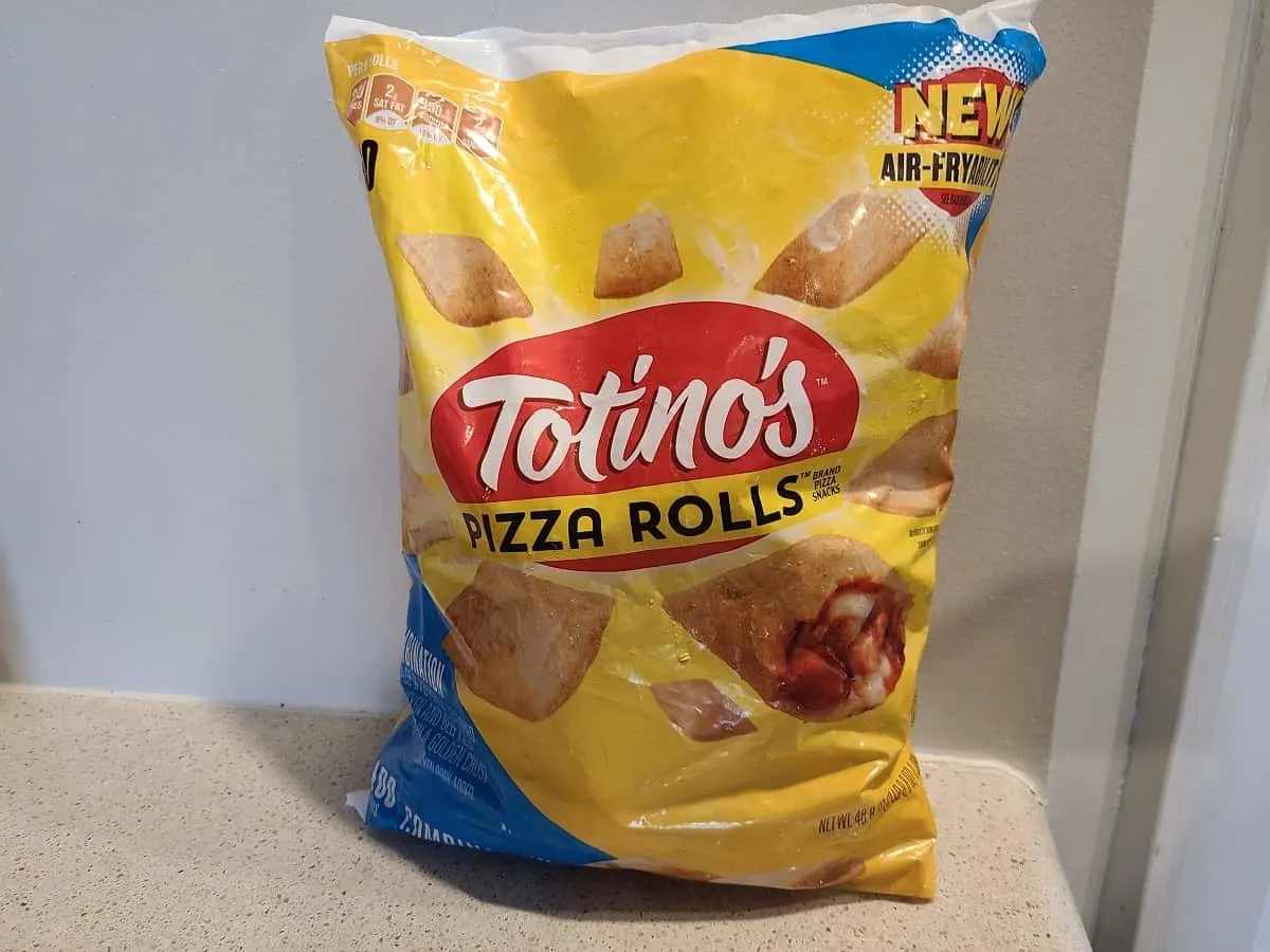 an image of a bag of frozen totino's pizza rolls