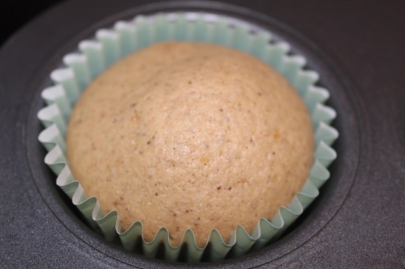 a perfectly baked cupcake in the oven