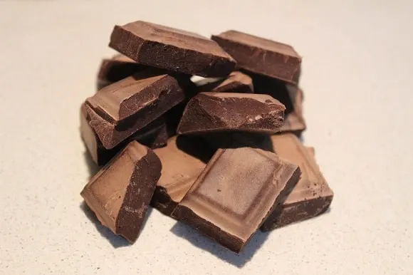 a pile of dark chocolate pieces