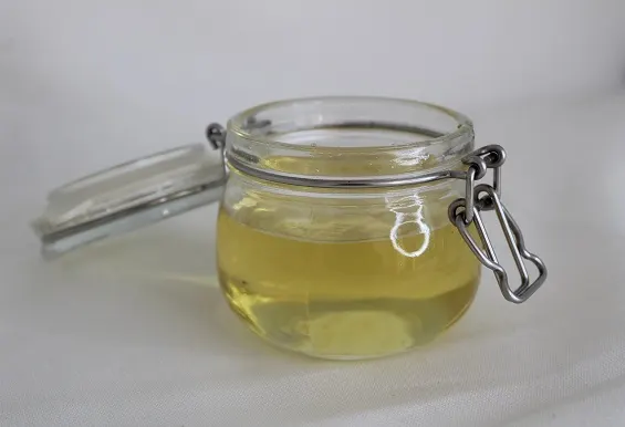 an opened jar with agave nectar
