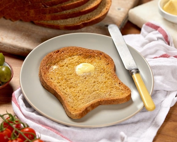a slice of toast with butter on it.
