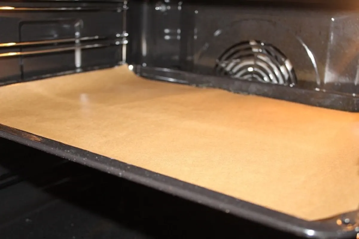 a solid oven rack lined with brown parchment paper