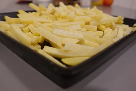 a big serving of french fries thawing in the kitchen