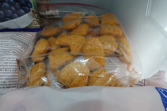 Chicken nuggets in a zip-lock bag in the freezer