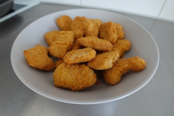 a portion of thawing frozen chicken nuggets on the kitchen counter