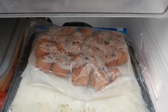 a bag of frozern meatballs in the freezer
