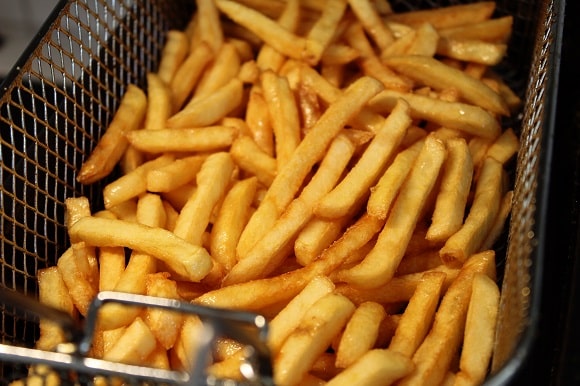 crispy french fries fresh out of the deep fryer
